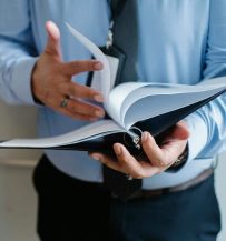 Photo by Sora Shimazaki Businessman reading documents in office